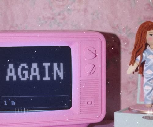 A pink TV says AGAIN AGAIN beside a rag doll